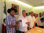 Activists with Governor Aguirre in Mexico as he signs CECOP’s proposal on Aug 16, 2012. Flickr photo by Felipe de Jesús Salinas Galván