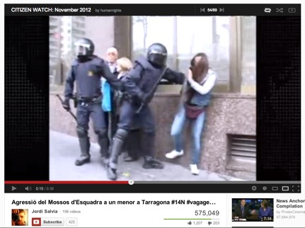 Screen shot from video uploaded to YouTube showing riot police beat a teenage boy in Tarragona, Spain