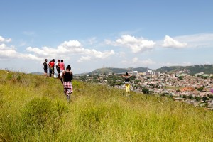 Training participants look over the proposed path of Tronco Avenue in Porto Alegre, Brazil.