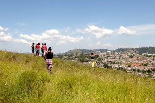 Training participants look over the proposed path of Tronco Avenue in Porto Alegre, Brazil.